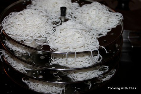 idiyappam arranged on plates