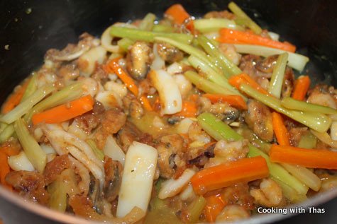 Making orange-seafood-salad